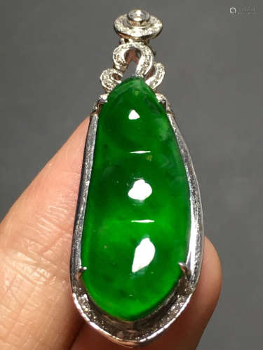 A ICY GREEN JADEITE CARVED BEAN PENDANT , TYPE A