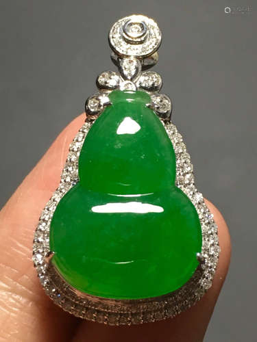 A ICY GREEN JADEITE CARVED GOURD PENDANT , TYPE A