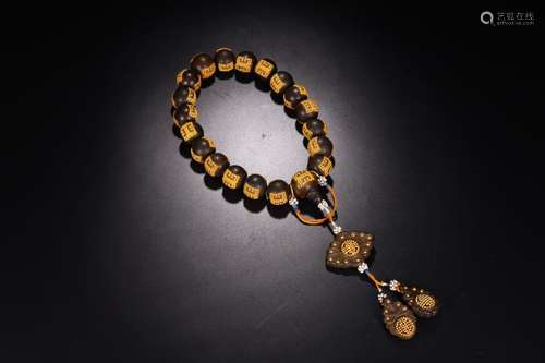 A CHENXIANG WOOD EMBEDED GOLD BEAD EIGHTEEN BEADS ROSARY