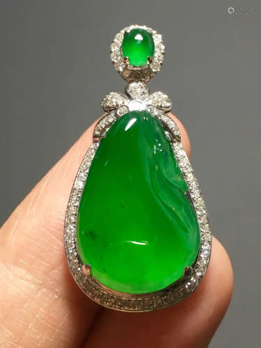 A ICY GREEN JADEITE CARVED BAG PENDANT , TYPE A