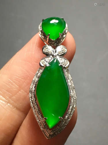 A ICY GREEN JADEITE CARVED PENDANT , TYPE A
