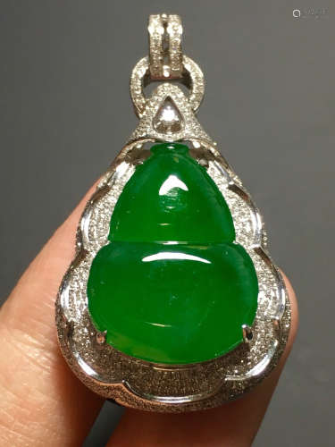 A ICY GREEN JADEITE CARVED GOURD PENDANT , TYPE A