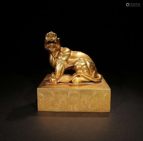 A GILT BRONZE BEAST SEAL