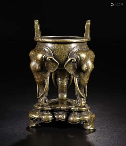 A GILT BRONZE ELEFANT HEAD SHAPED TRI-POD CENSER