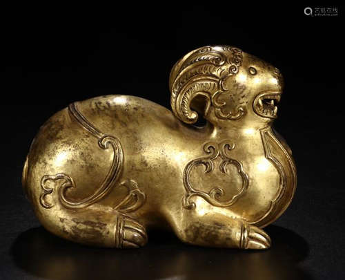 A GILT BRONZE GOAT SHAPED PAPERWEIGHT