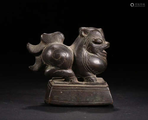 A BRONZE AUSPICIOUS MONSTER ORNAMENT