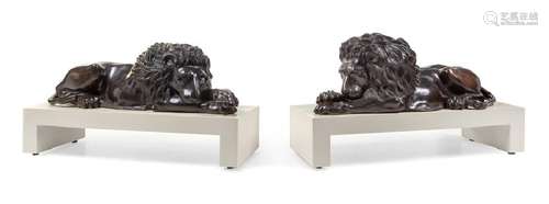 *A Pair of Continental Bronze Models of Recumbent Lions