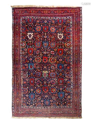 A Persian Wool Rug 13 feet 9 inches x 9 feet 2 inches.