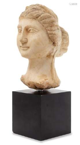 *A Carved Marble Head of a Woman Height 9 1/8 inches.