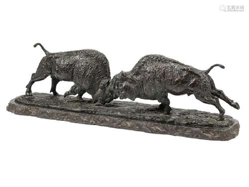 A Patinated Metal Figural Group of Buffalo raised on a