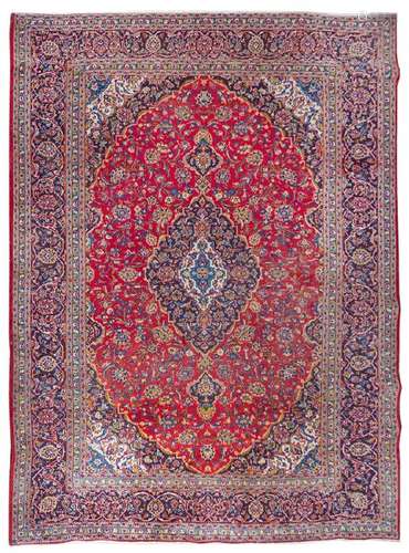 *A Tabriz Wool Rug 9 feet 8 inches x 12 feet 9 inches.