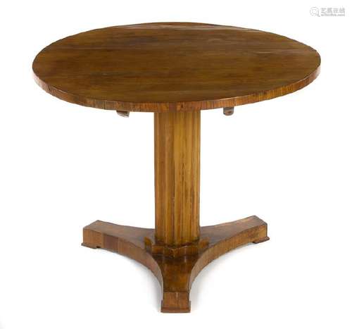 A Biedermeier Center Table  the circular top set on a