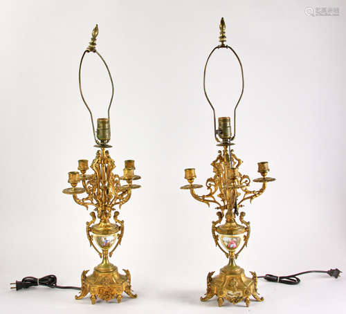 Pair of 19th century French bronze candelabrum, with central porcelain cups with hand-painted