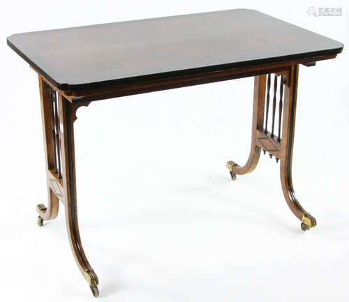 Regency-style oak table with ebonized moldings and brass casters, circa 1900, 29