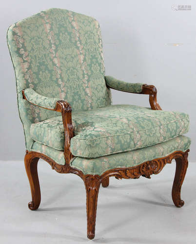 French Regency-style carved walnut armchair with green fabric, 40