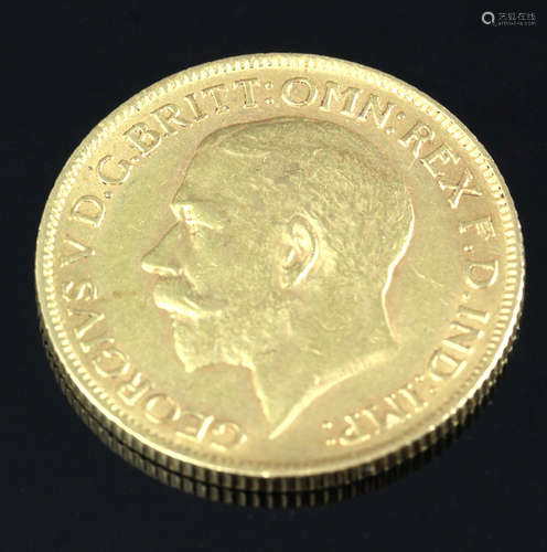 English 1911 gold sovereign, George V, approximately 7 grams total weight. Provenance: Florida