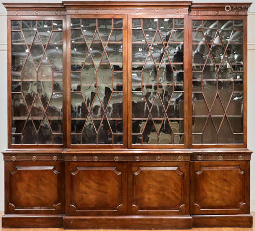 English Hepplewhite-style solid mahogany breakfront, having individual mullion paneled doors, 85