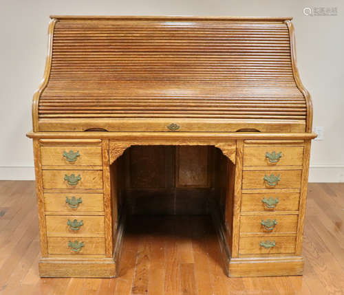 Antique raised panel golden oak s-roll top desk, possibly made by Derby Desk Company. Provenance: