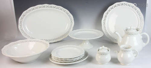 White china dessert set, reticulated border bands, to include teapot, cream, sugar, footed