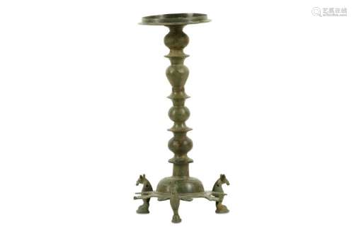 A BRONZE THREE-FOOTED OIL LAMP STAND Iran, 10th - 12th