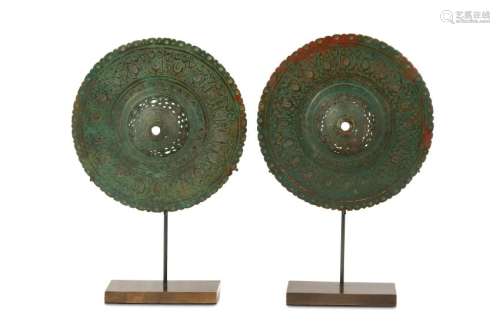 TWO PIERCED AND ENGRAVED BRONZE BOSSES Iran, 10th -