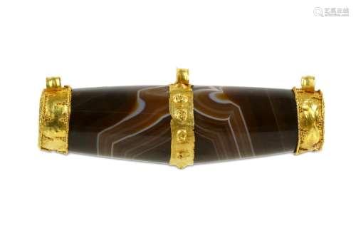 A SELJUK BROWN BANDED AGATE NECKLACE BEAD Iran, 12th -