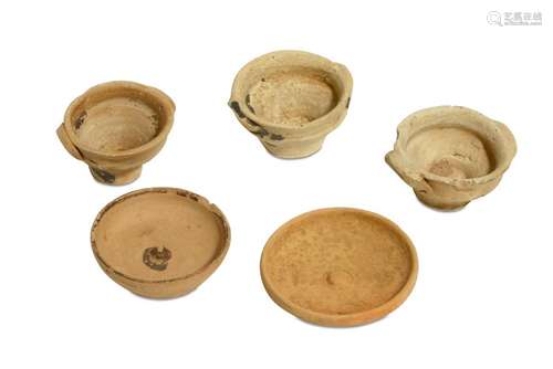 A GROUP OF FIVE MINIATURE TERRACOTTA VOTIVE VESSELS