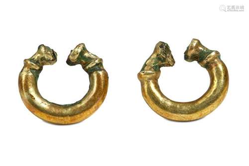 A PAIR OF WESTERN ASIATIC GOLD ON BRONZE EARRINGS