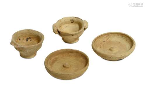 A GROUP OF FOUR MINIATURE TERRACOTTA VOTIVE VESSELS