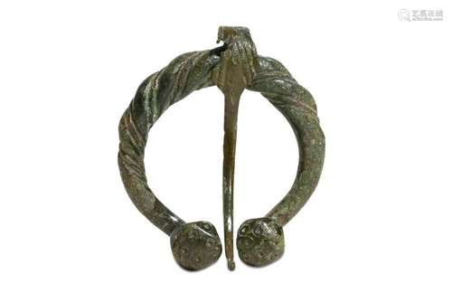 A VIKING BRONZE PENANNULAR BROOCH