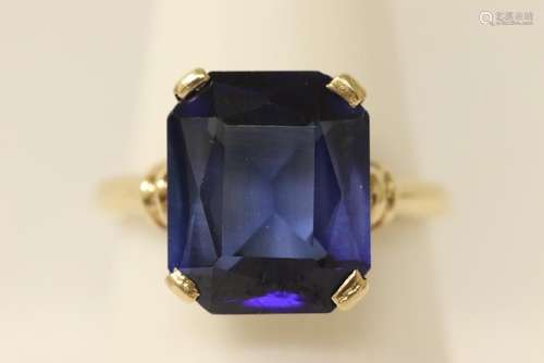 14K Y/G ring set with a large step cut blue stone