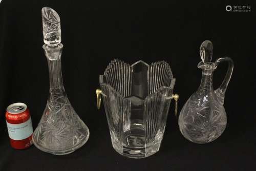 2 crystal decanters and a crystal ice bucket