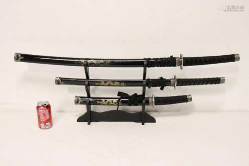 3 piece sword set on stand