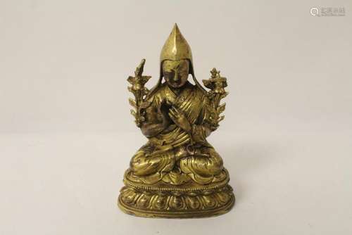 An important Tibetan gilt bronze sculpture of deity