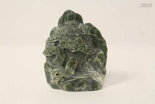 Green jade like stone carved boulder