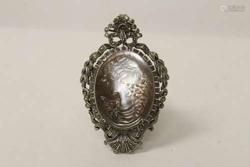 A silver brooch w/ MOP cameo