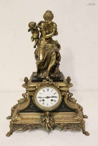 antique French table clock decorated with gilt metal