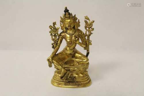 An important Chinese gilt bronze sculpture of deity