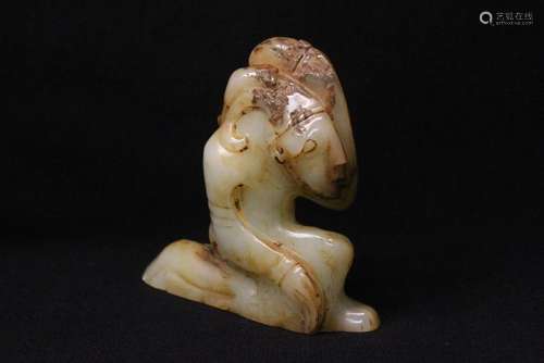 White jade carving depicting kneeling figure