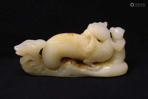 White jade carving depicting boy with phoenix