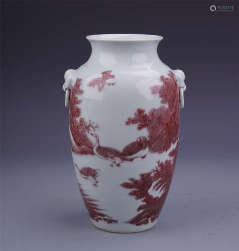 A Chinese Undergalzed Red Vase with Twin Lion Handles