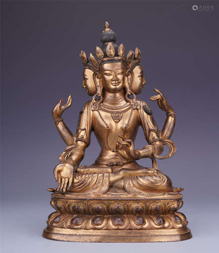 A Chinese Gilt Bronze Figure of Seated Three-sided Buddha