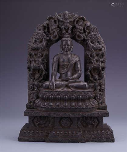 A Chinese Stone Carved Figure of Sakyamuni with Mandorla