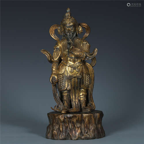 A Chinese Gilt Bronze Standing Figure of the God of Wealth