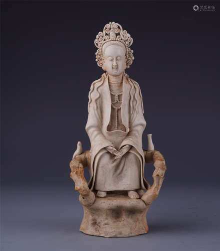 A Chinese White Stoneware Figure of Seated Guanyin