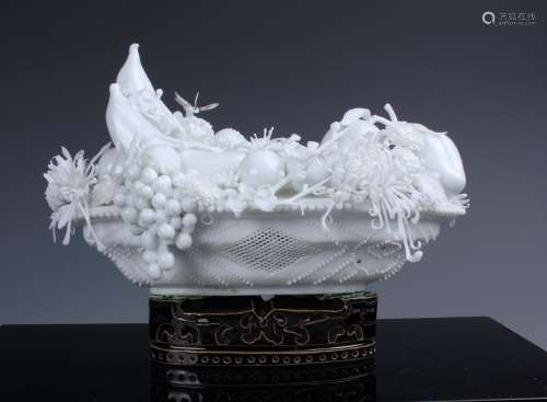 A Chinese Carved White Porcelain Flower and Fruit Ornament