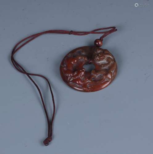 A Chinese Carved Red Jade 'Dragon' Pendent