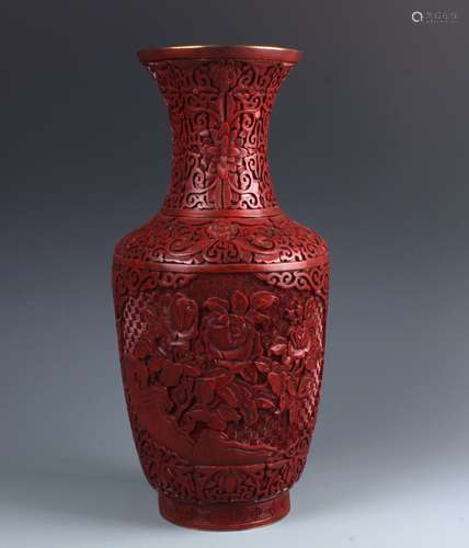 A Chinese Carved Cinnar Red Lacquered Vase