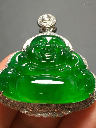 AN ICY GREEN BUDDHA SHAPED JADEITE PENDANT