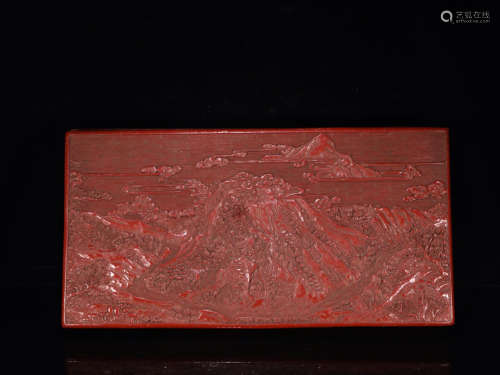 A RED LACQUER WOOD BOX CARVED LANDSCAPE PATTERN